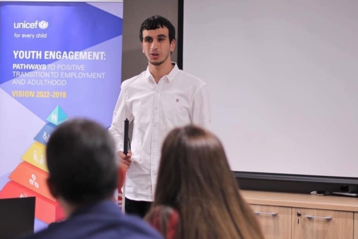 Hasan speaking at a UNICEF youth engagement event